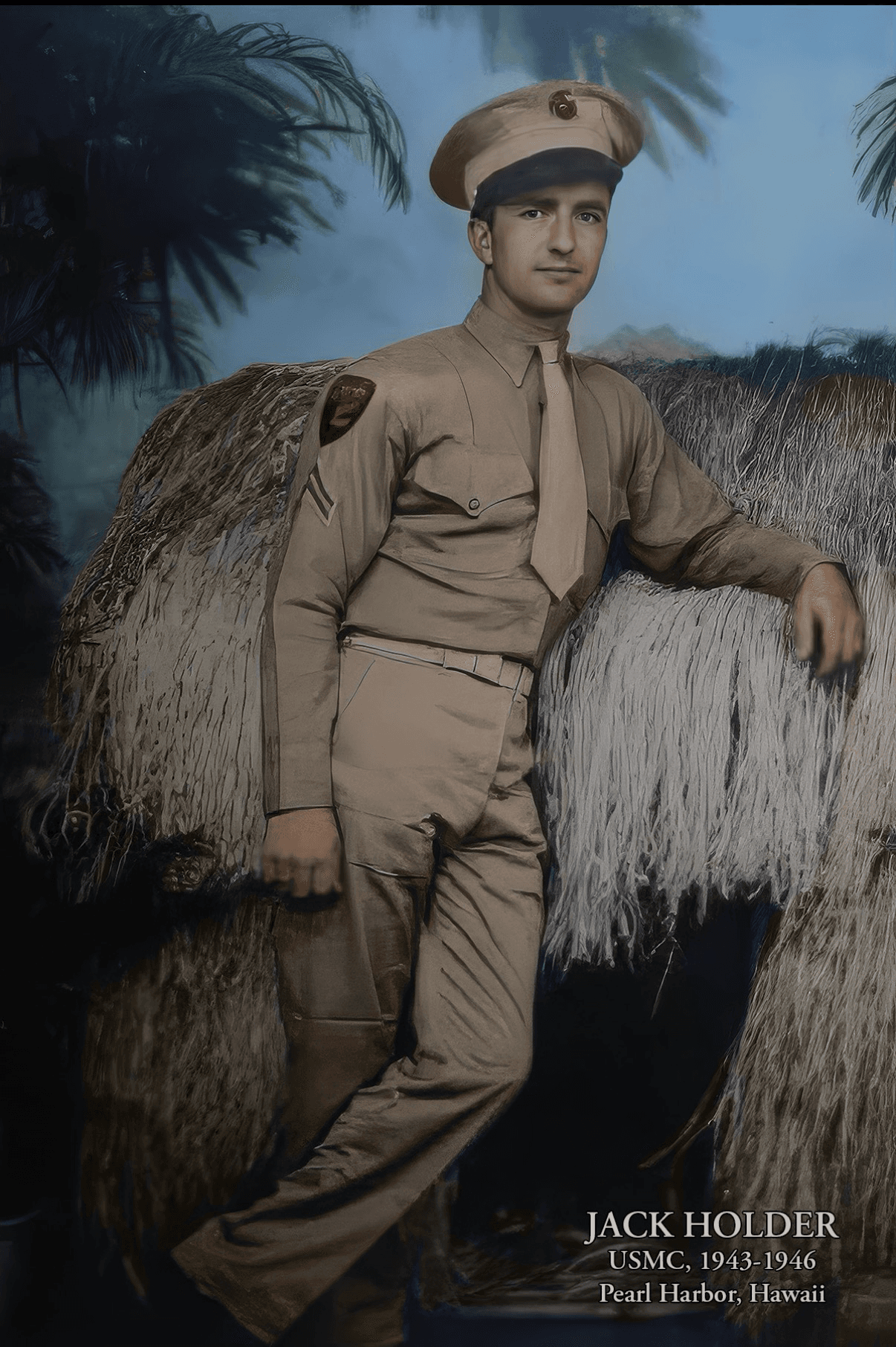 Hand-colored portrait of a young Jack Holder in a Marine Corps khaki uniform and cap, leaning on a thatched hut. Text on the photo reads: Jack Holder, USMC, 1943–1946, Pearl Harbor, Hawaii.