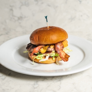 hamburger with bacon lettuce and tomatoes